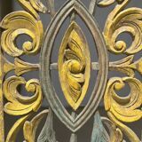 Rectangular Indonesian construction element with blue and yellow plant in carved wood