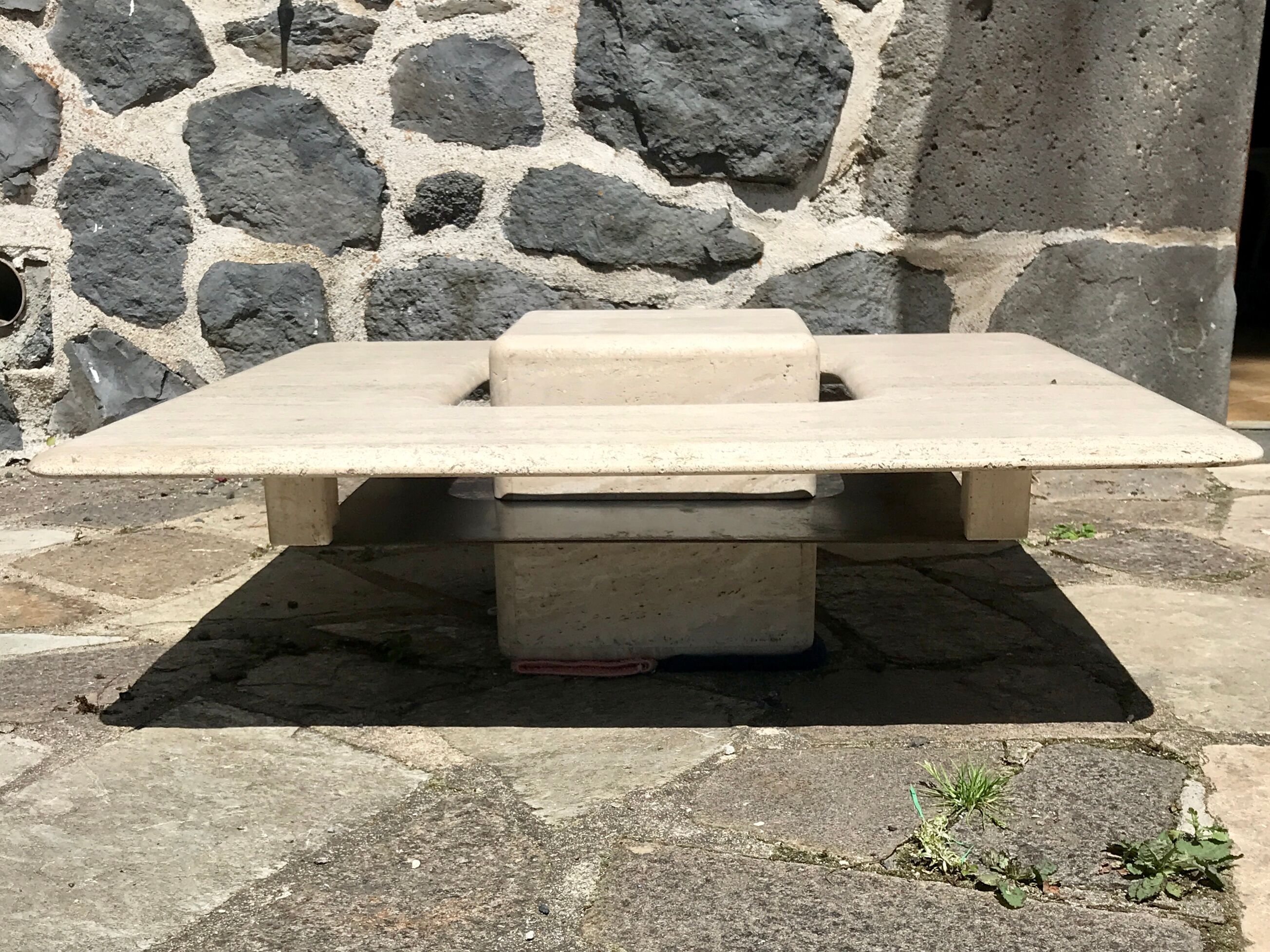 Sculptural travertine coffee table