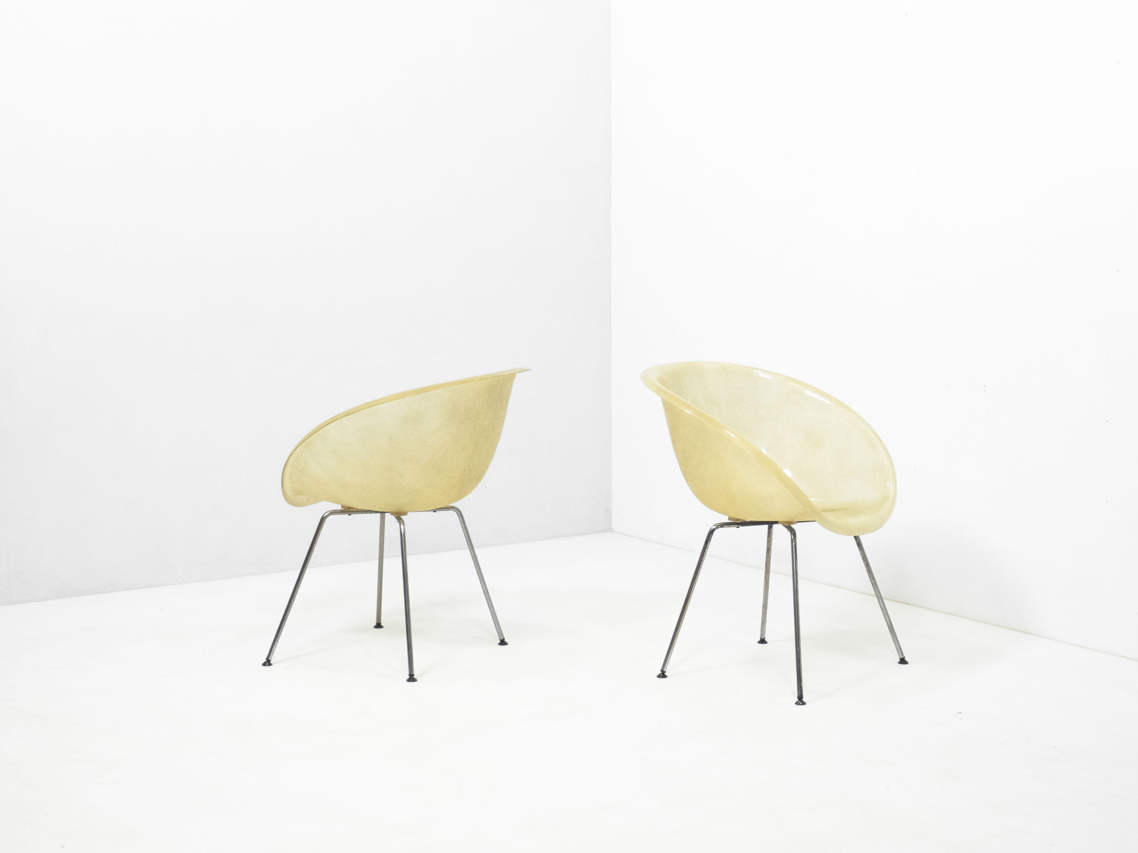 Set of two vintage fiber glass shell chairs