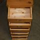 Restored vintage military high chest of drawers in English pine and brass.