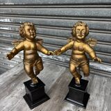 Pair of gilded cherubs on a Napoléon III base