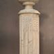 Column topped with a plaster basin.