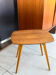 Vintage wooden side table with tapered legs.