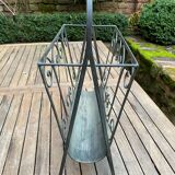 Art Deco magazine rack in wrought iron with bronze patina from around 1930-1940.