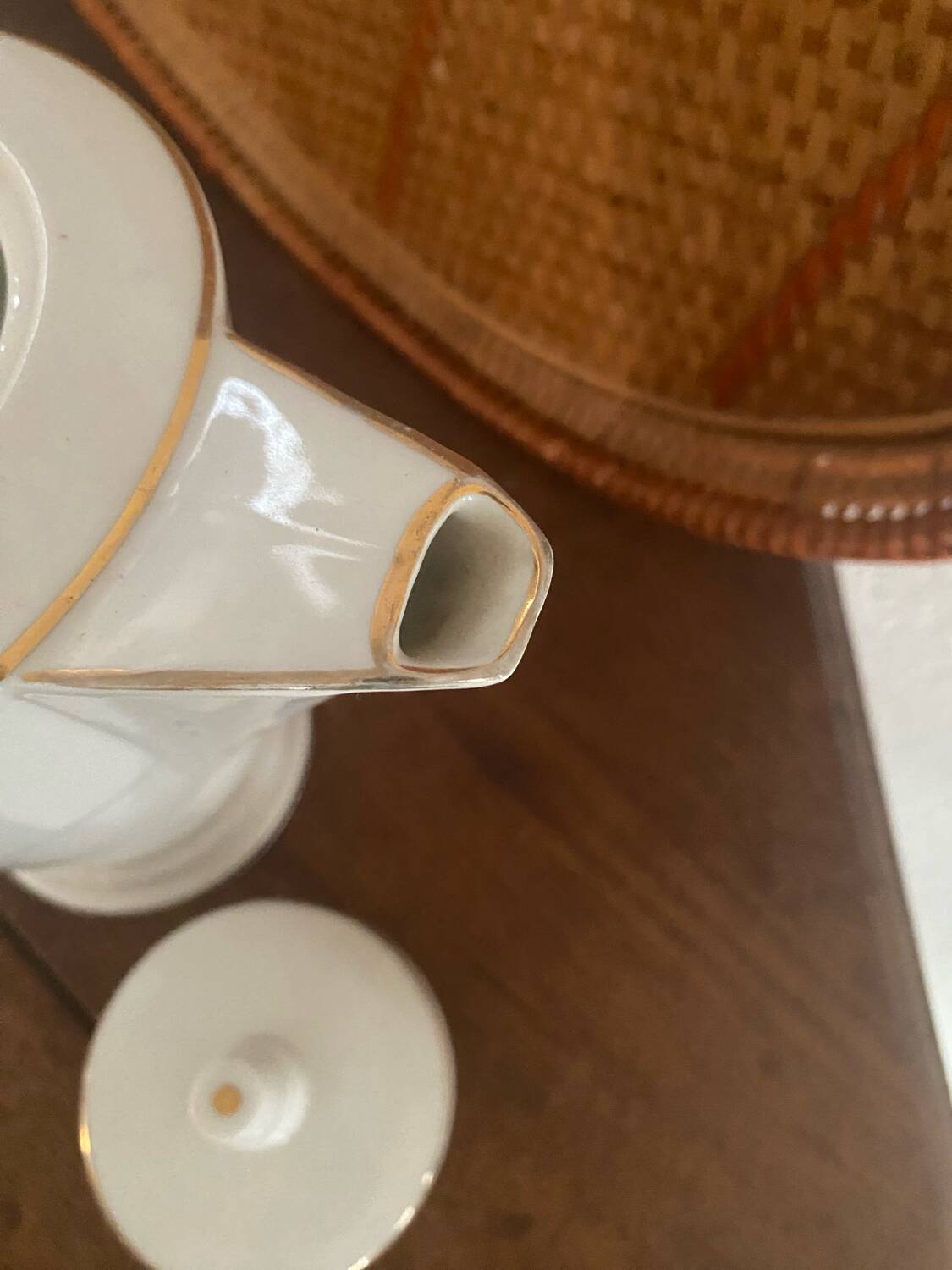 White and gold porcelain coffee pot in art deco style.