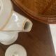 White and gold porcelain coffee pot in art deco style.