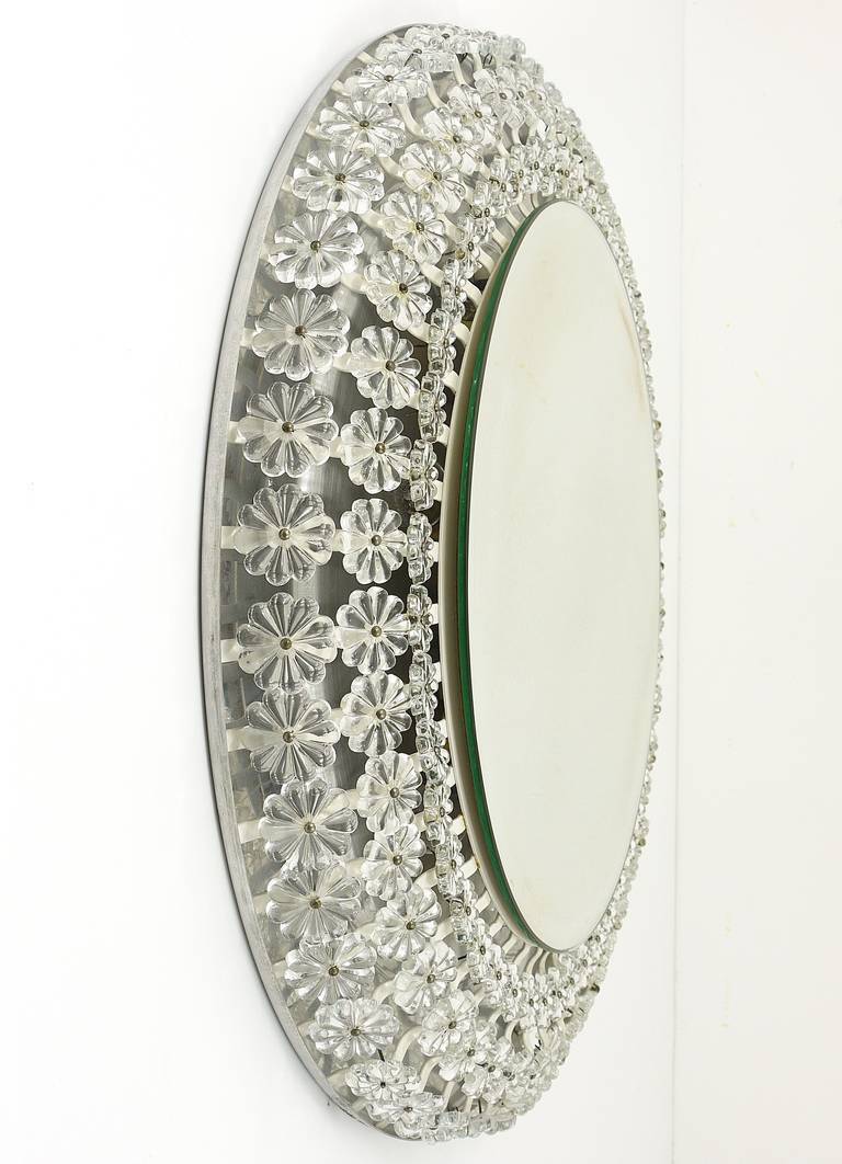 Large round wall mirror with glass flowers by Emil Stejnar, backlit by Nikoll, Austria.