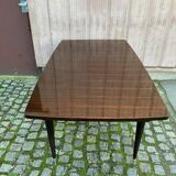 Scandinavian extendable dining table made of solid wood and rosewood effect.