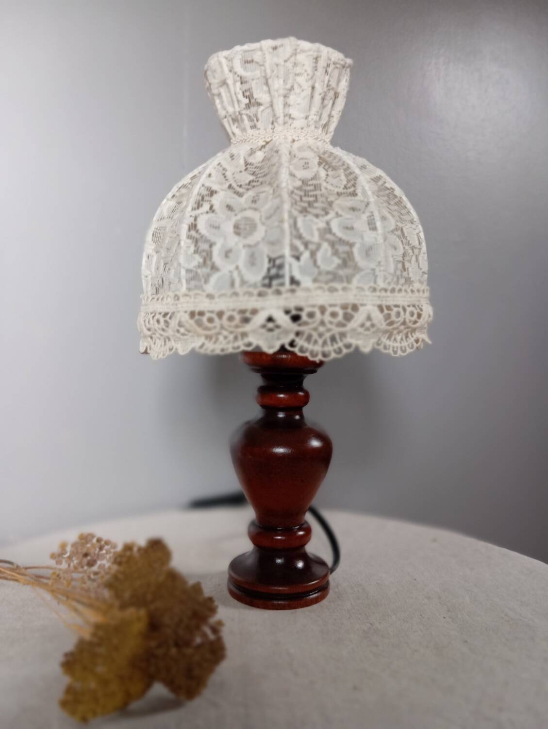 Table lamp with romantic wood and lace ambiance, retro chic