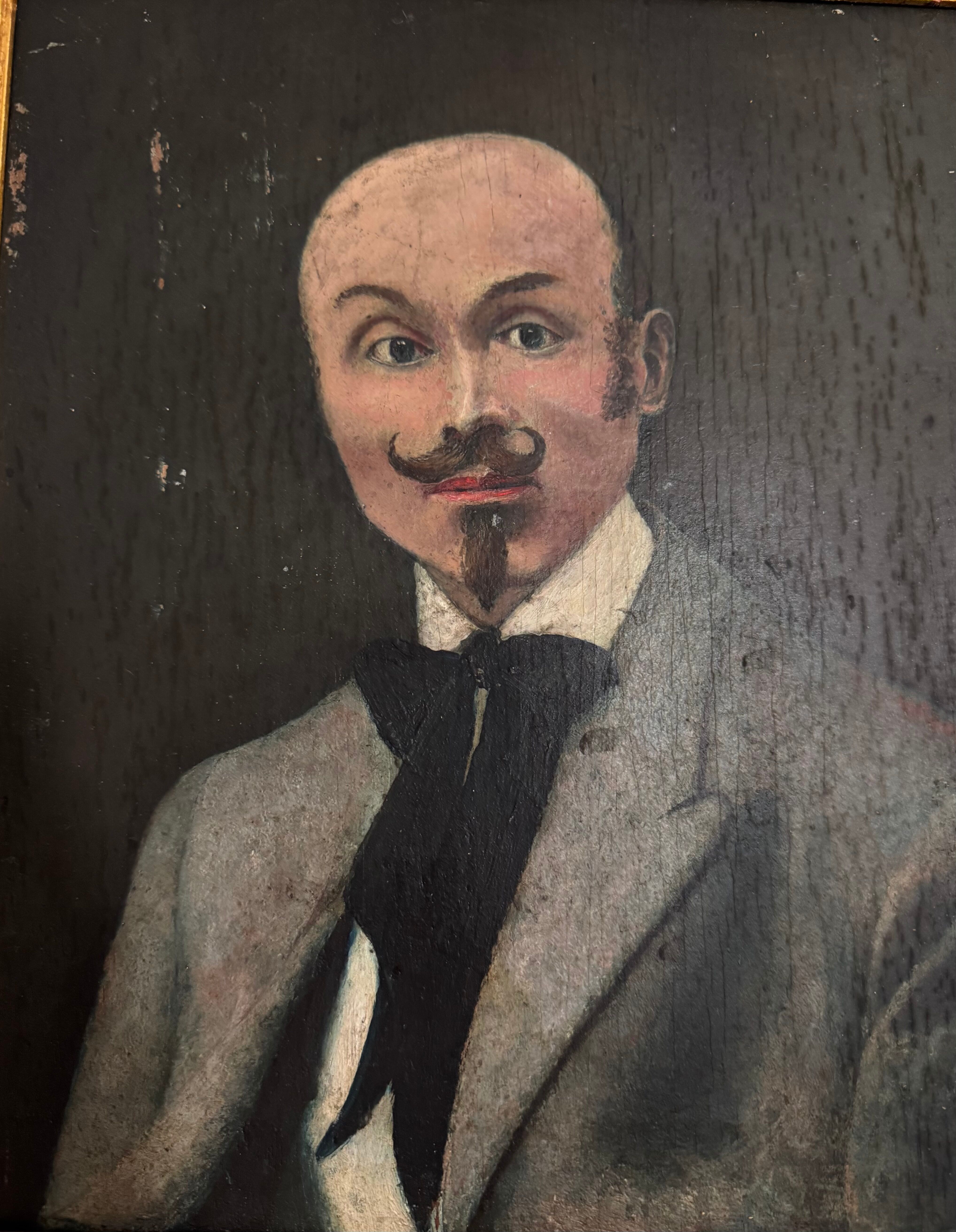 Portrait of a dandy with a moustache from the early 20th century.