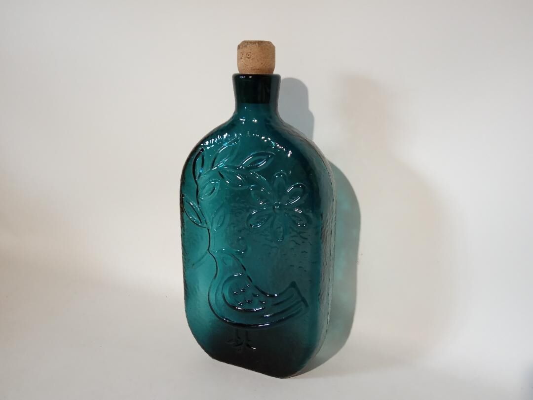 Blue glass bottle bird décor
