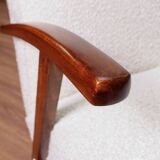 Vintage armchair in pearl white bouclé with walnut wood, 1960.