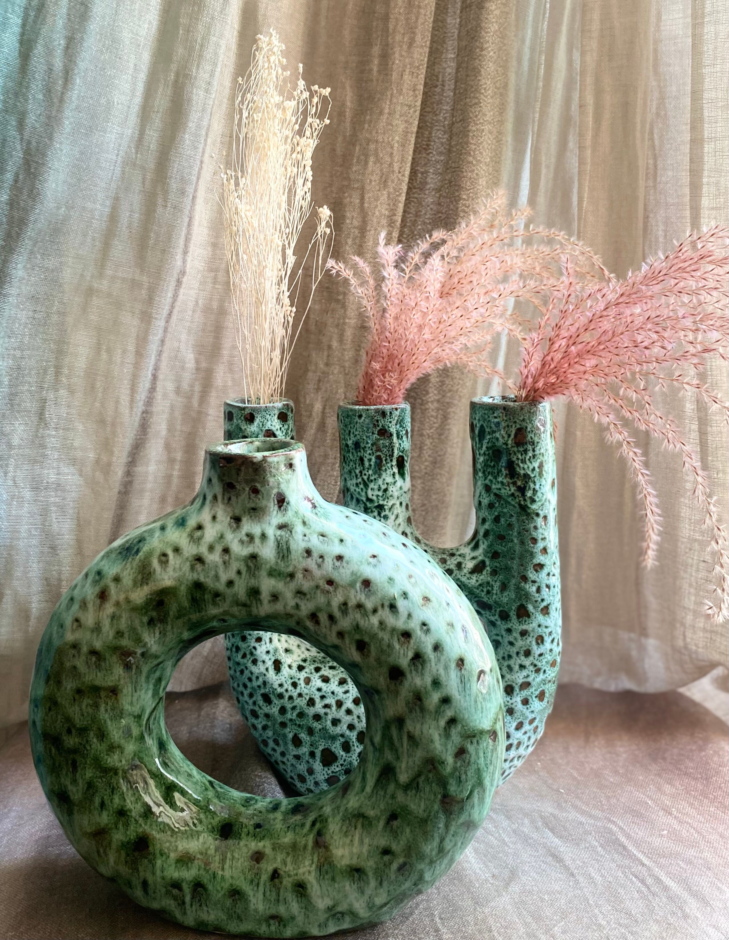Handmade terracotta donut vase in light green terracotta