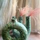Handmade terracotta donut vase in light green terracotta