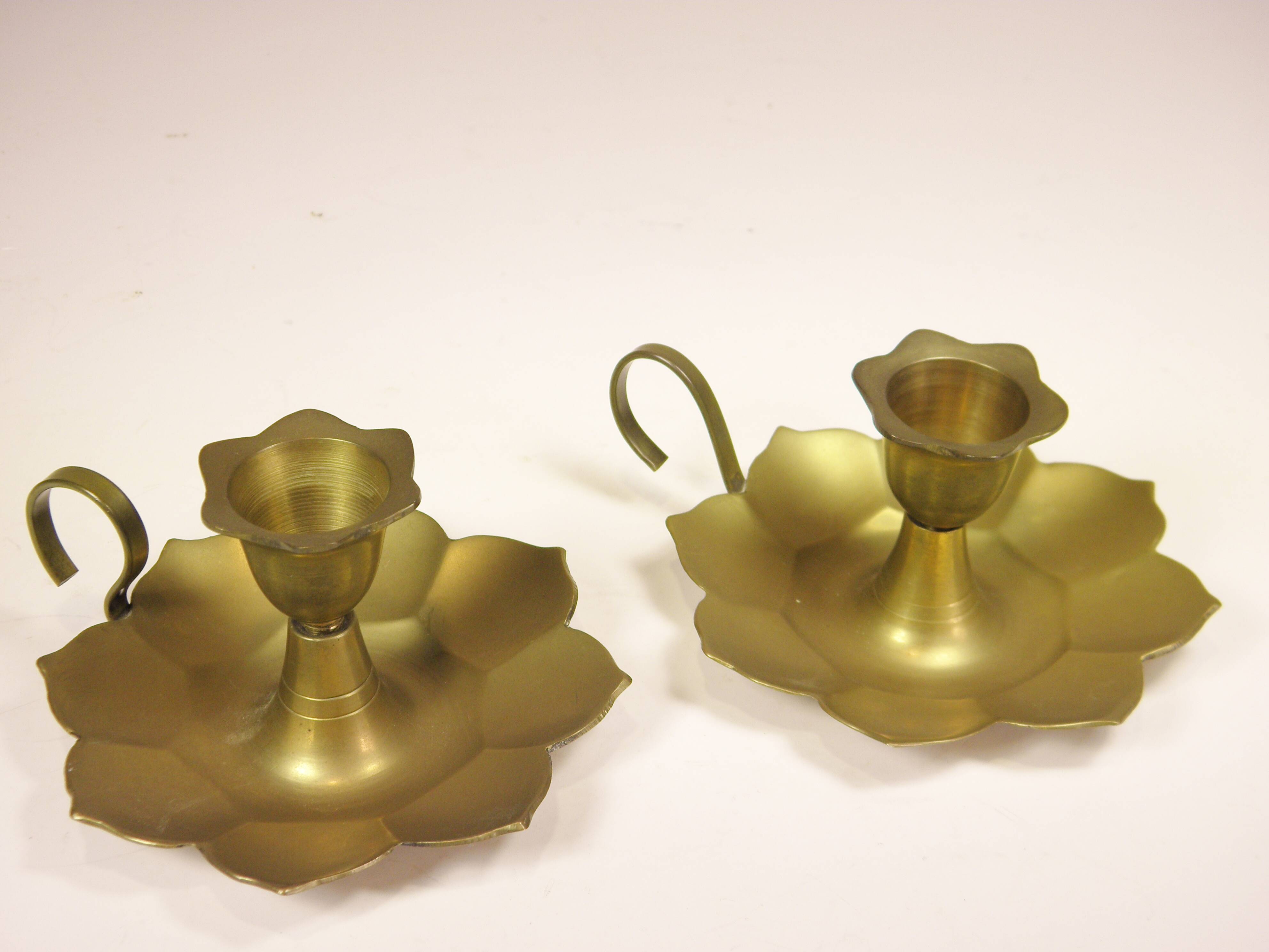 Pair of brass "flower" candlesticks