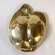 Brass catchall in the shape of an apple.
