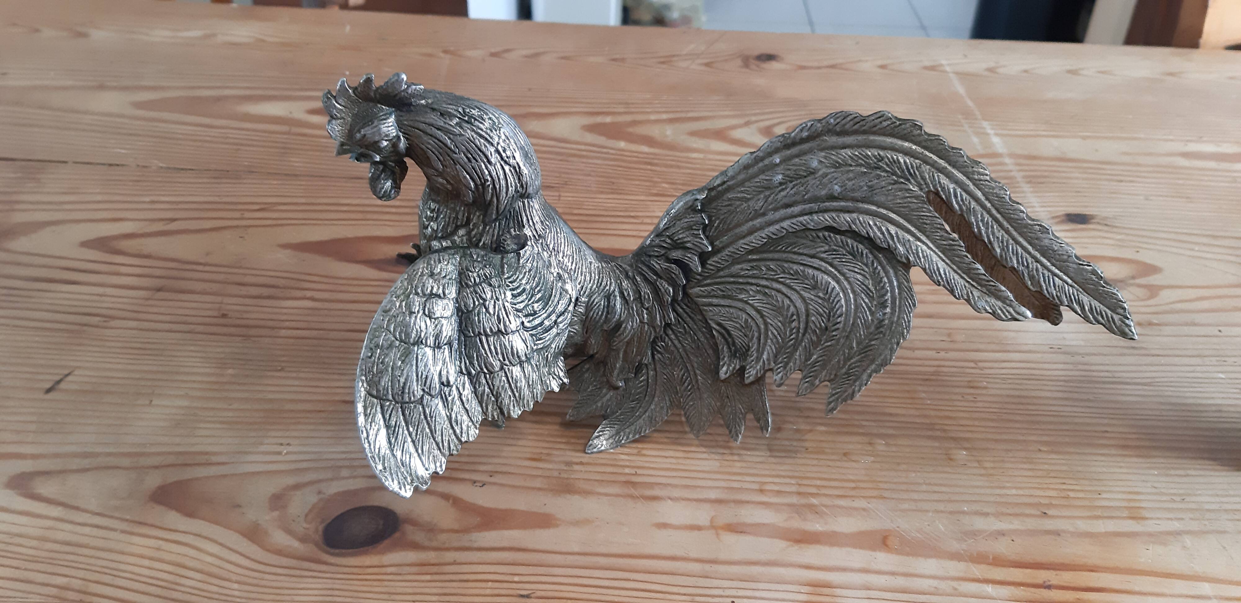 2 silver metal roosters