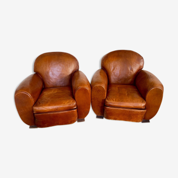 Paire de fauteuils club en cuir