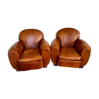 Paire de fauteuils club en cuir