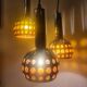 Raak three-light space age orange pendant lamp, 1970s, Netherlands