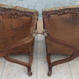 Paire de fauteuils Régence en noyer sculpté