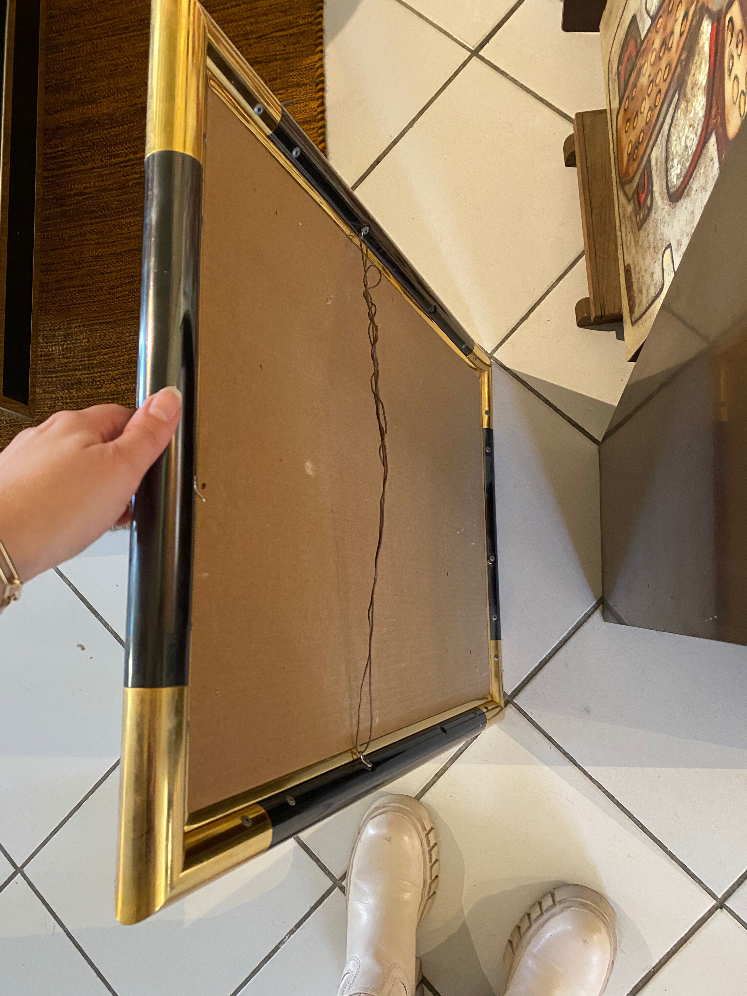 Steel and brass mirror, 47x67 cm