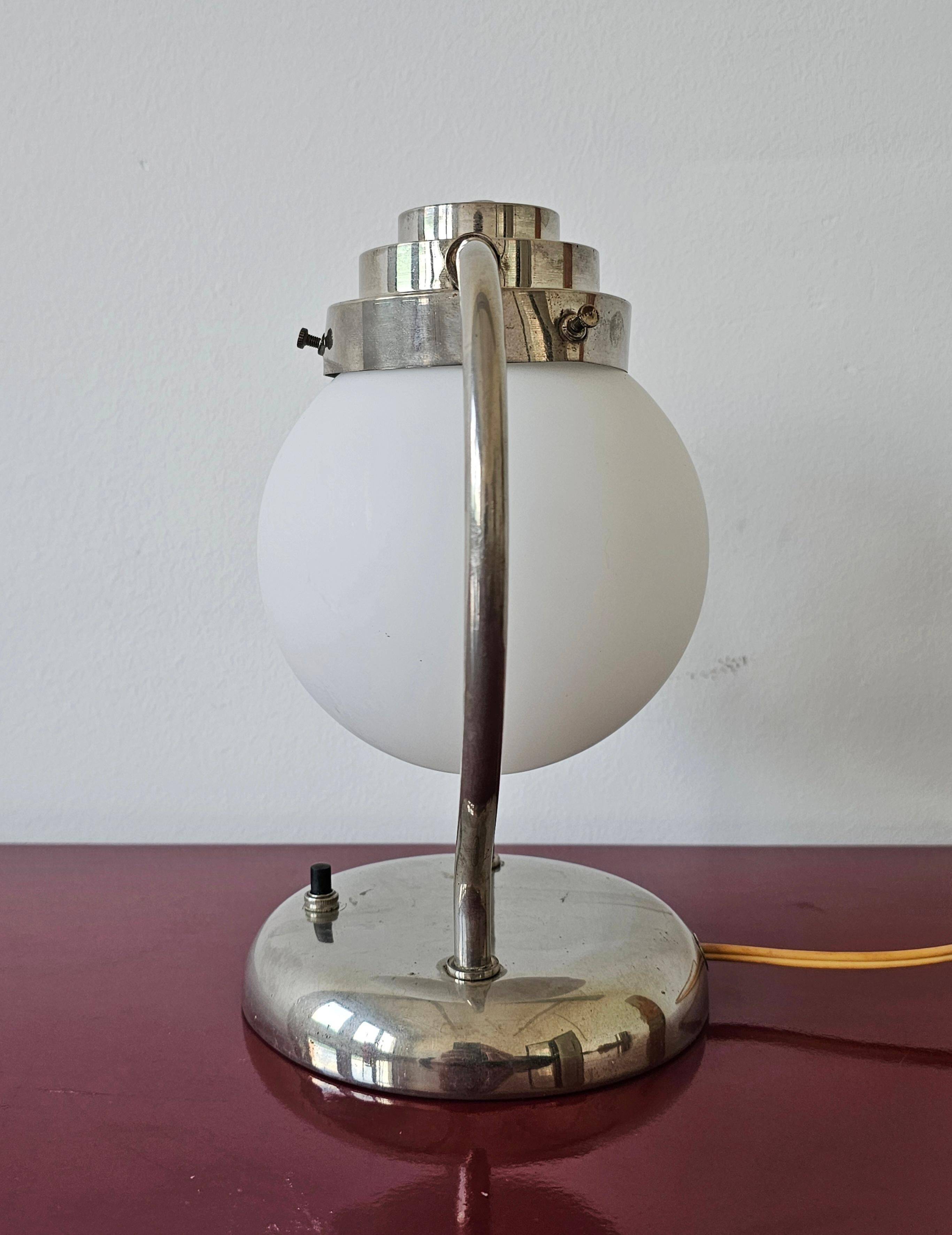 Art Deco table lamp with a spherical opaline glass shade and chrome base from the 1930s.