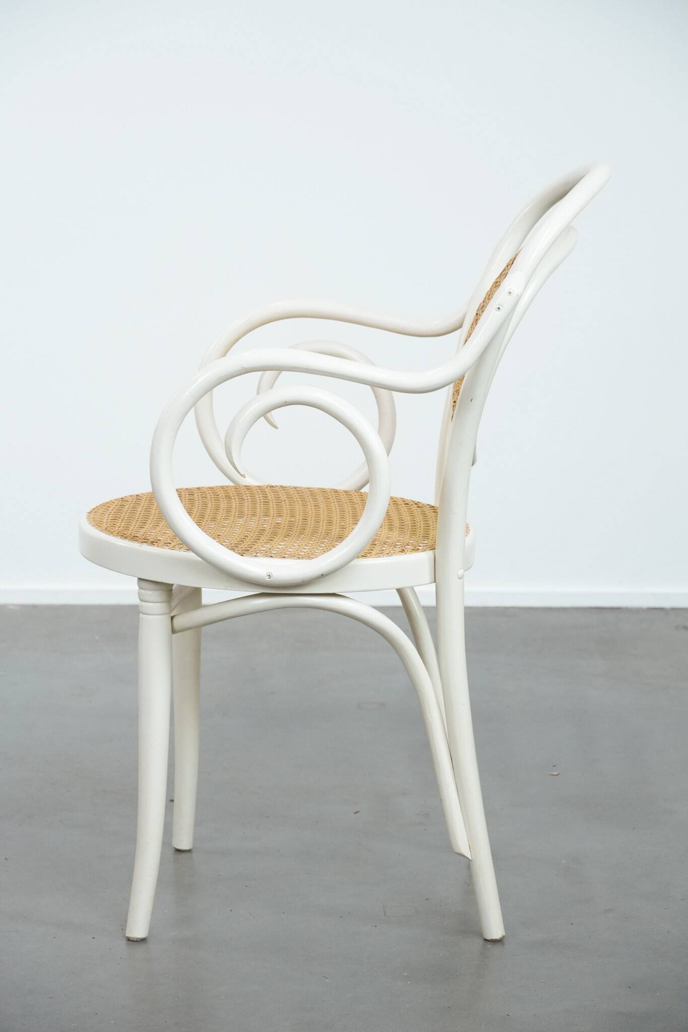 Vintage white bistro chair with armrests in Thonet style