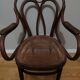 Canned armchair in curved wood signed J.Kohn