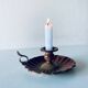 Old candle holder in brown enameled metal