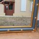 Louis-philippe grey and gilt mirror decorated in the antique style