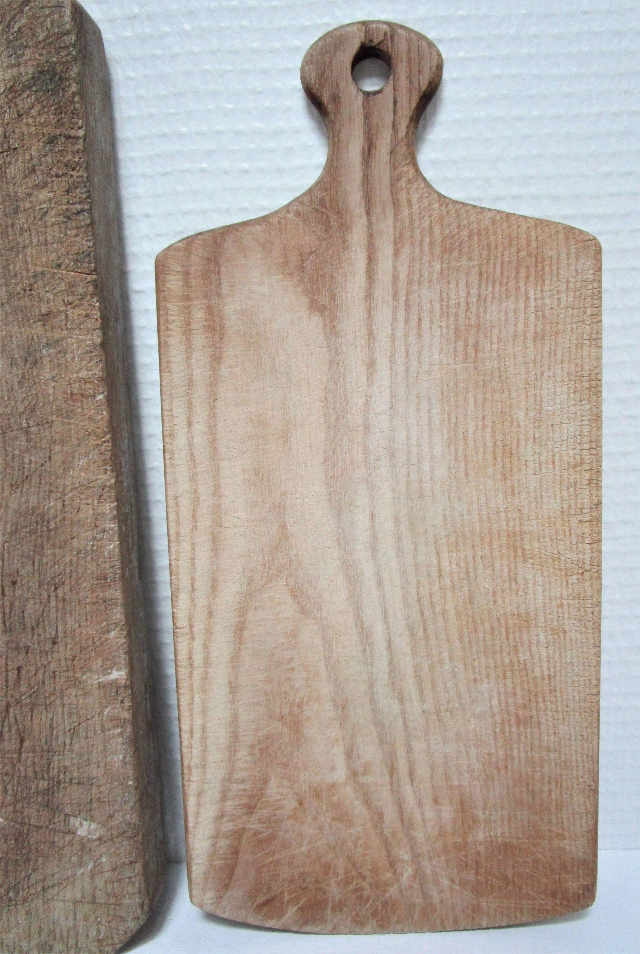 three vintage patinated solid wood cutting boards