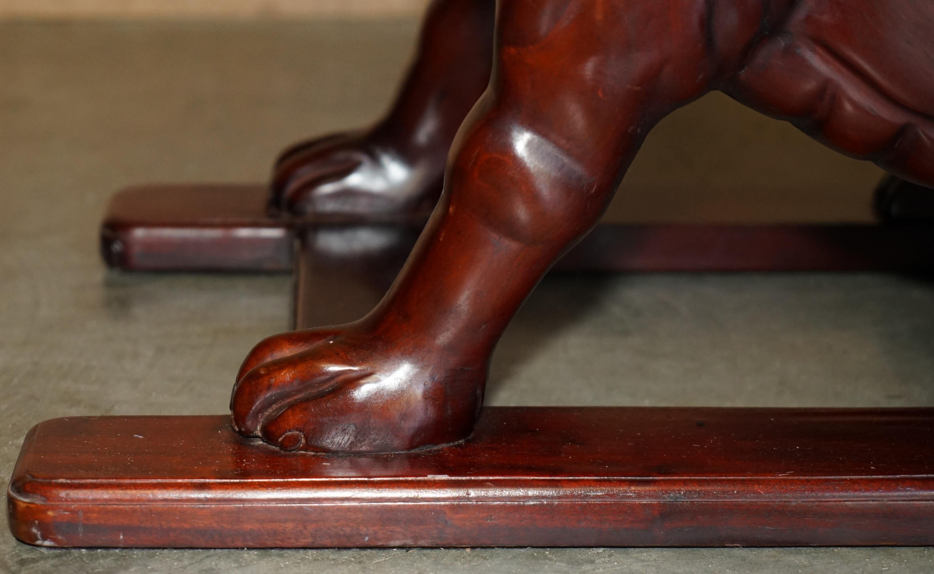 Pair of hardwood library steps with carved dogs, Regency style.