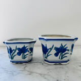 Duo of decorative plant pots with blue irises.