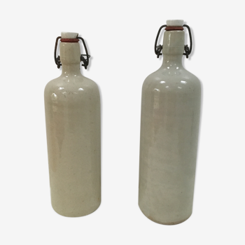 Duo of old bottles in glazed sandstone