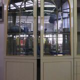 Showcases in lacquered wood, glass and brass  1970s, set of 4
