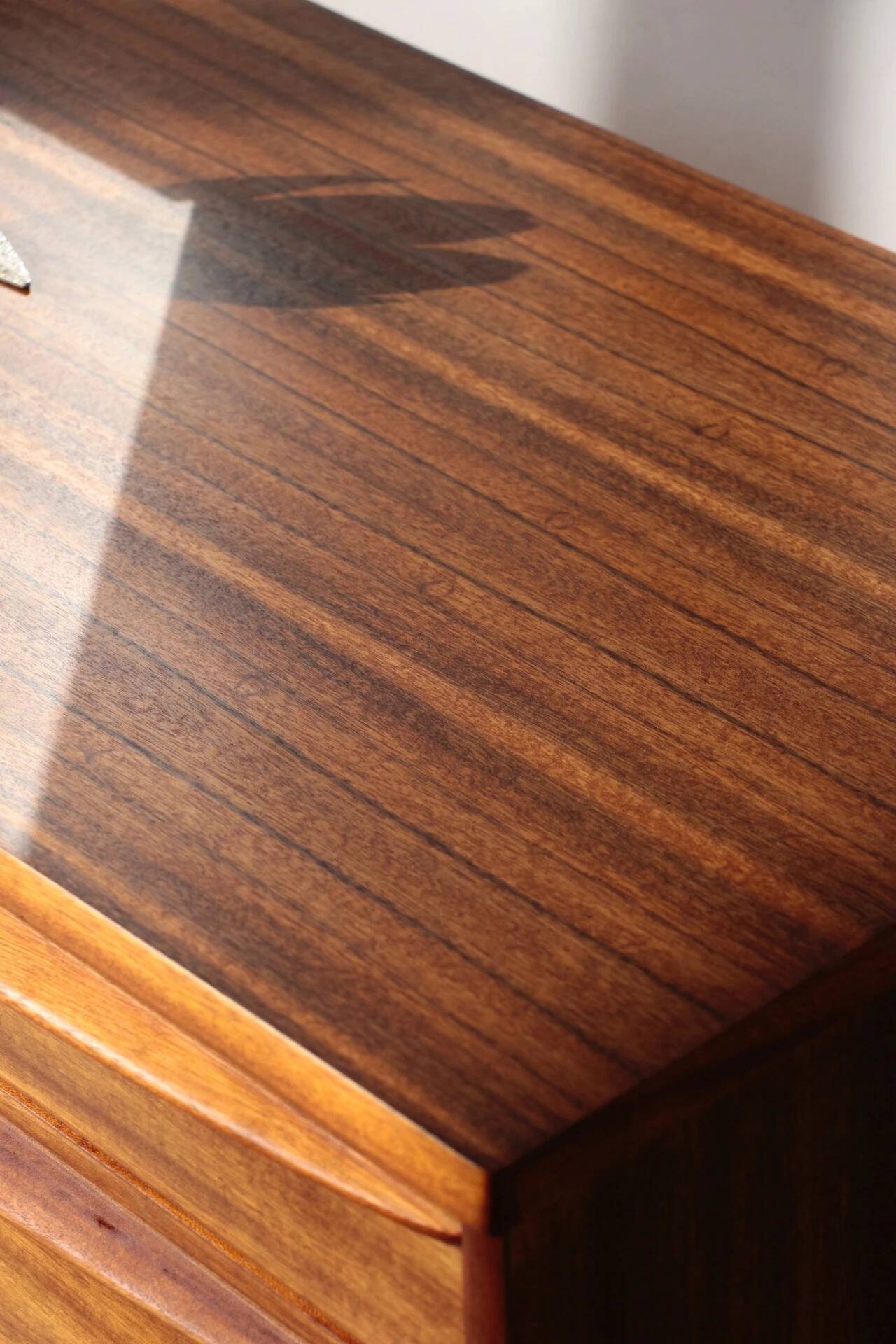 Vintage zebrano and walnut furniture from Morris of Glasgow.