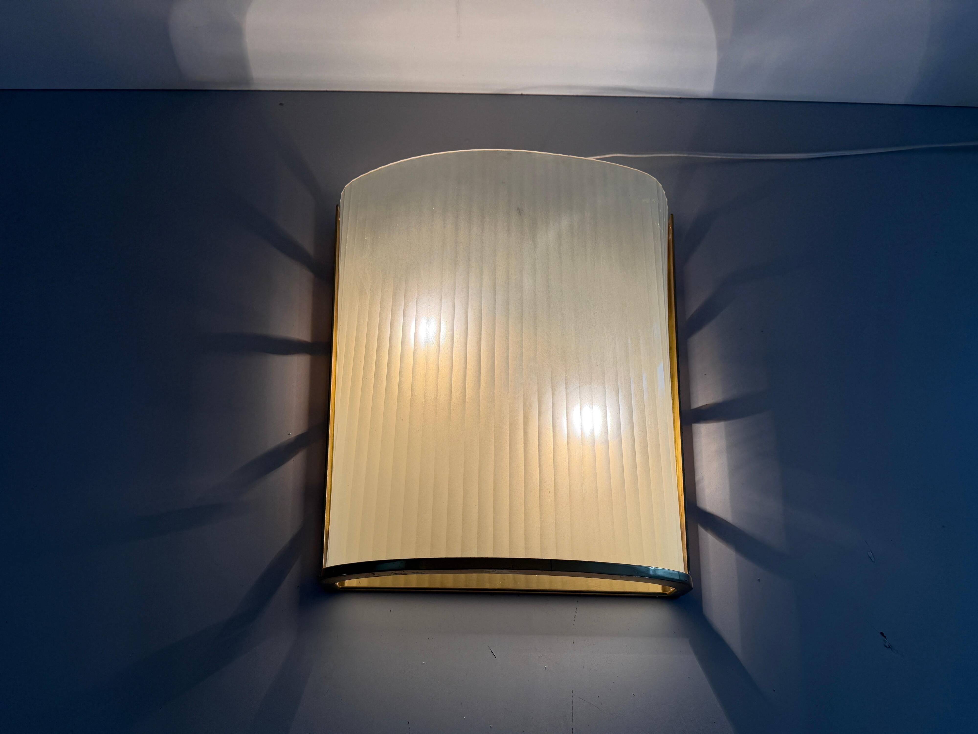 Large heavy glass wall light with a brass frame from the mid-century, 1950s, Italy.