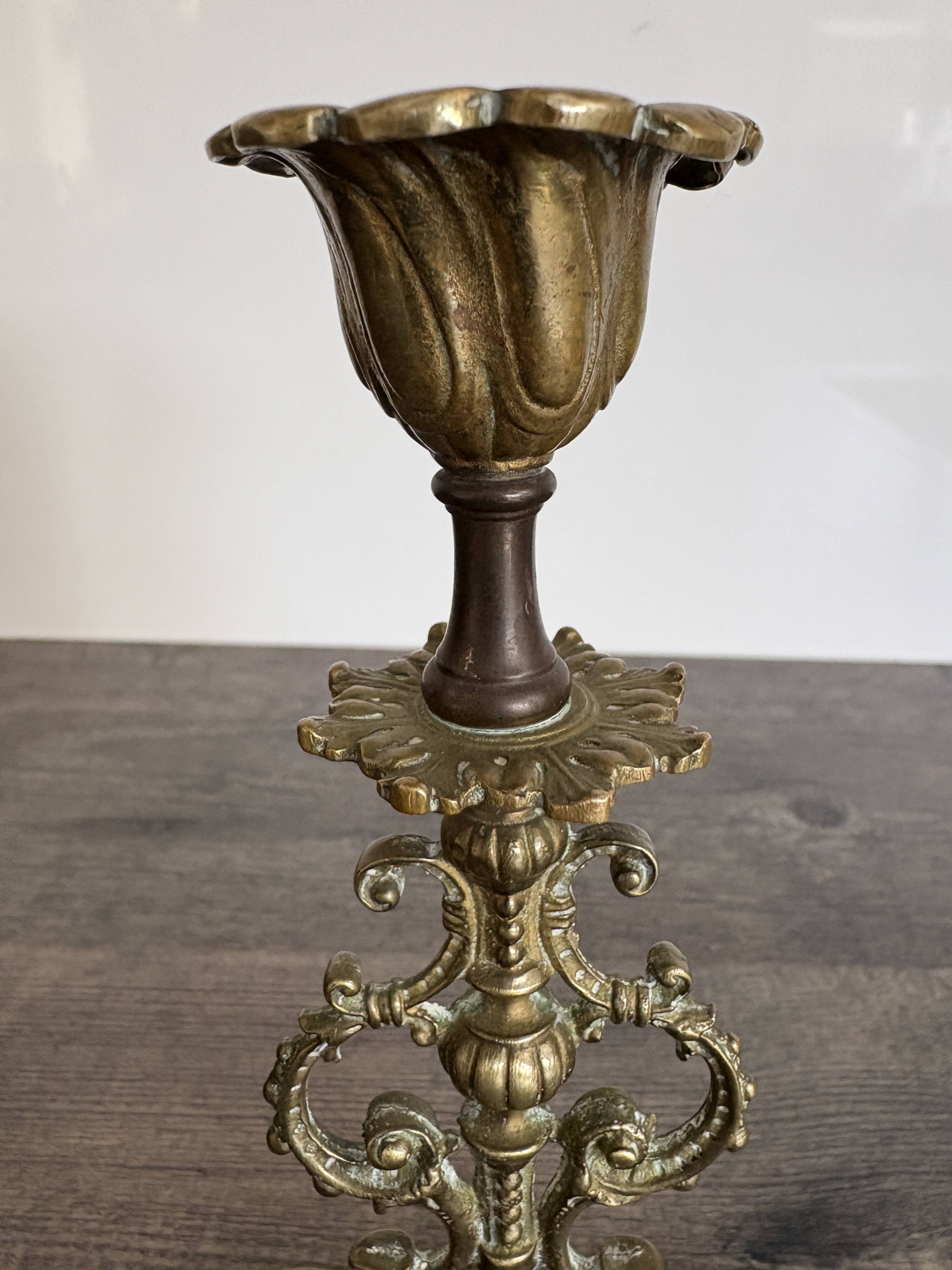 Antique chiselled bronze candlestick