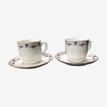 Paire de tasses et sous tasses en porcelaine fine motif fleural