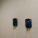 Wall lamps made of black cast iron and handmade thick pressed blue glass