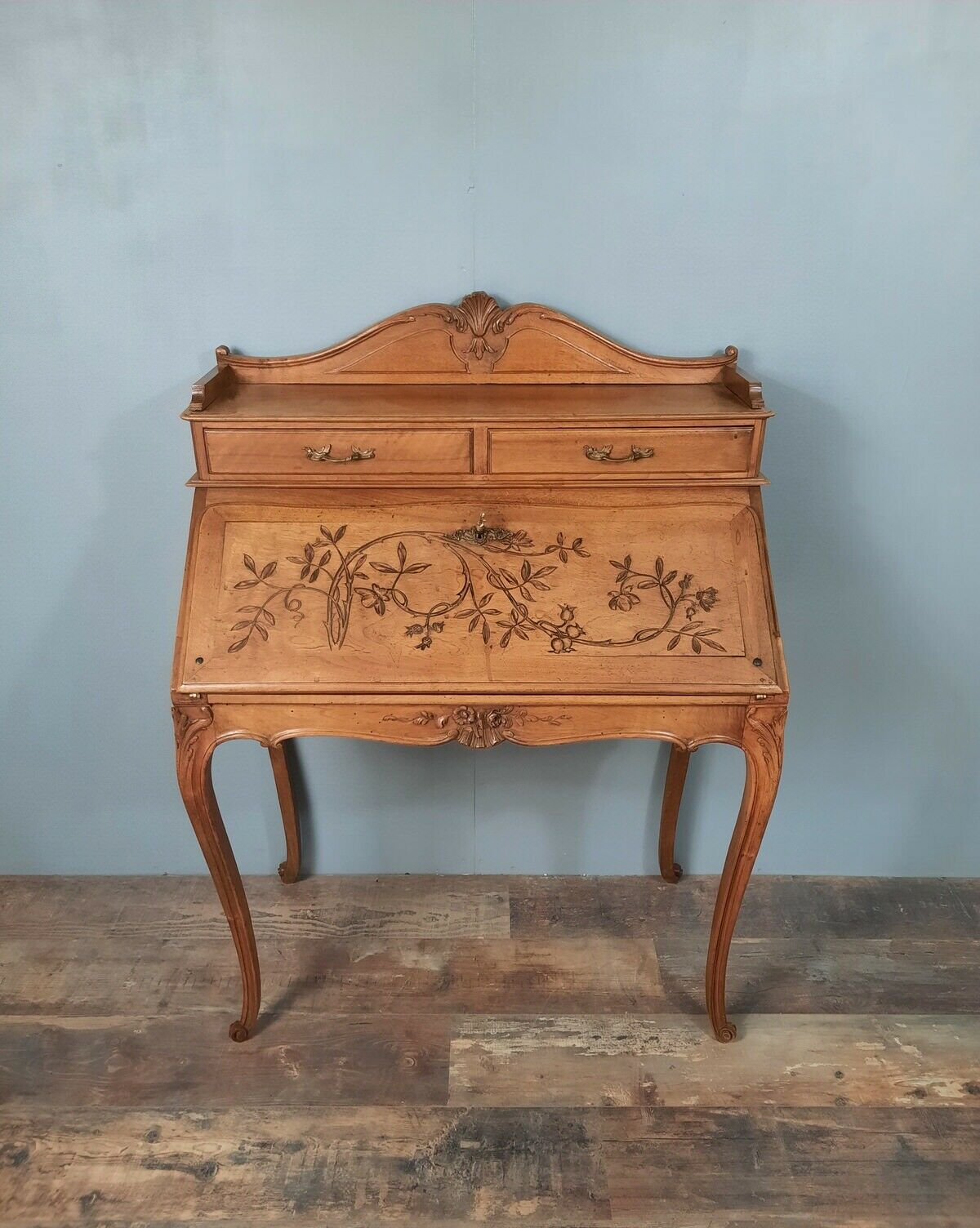 Louis XV style stepped donkey back desk in walnut in early 1900