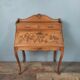Louis XV style stepped donkey back desk in walnut in early 1900