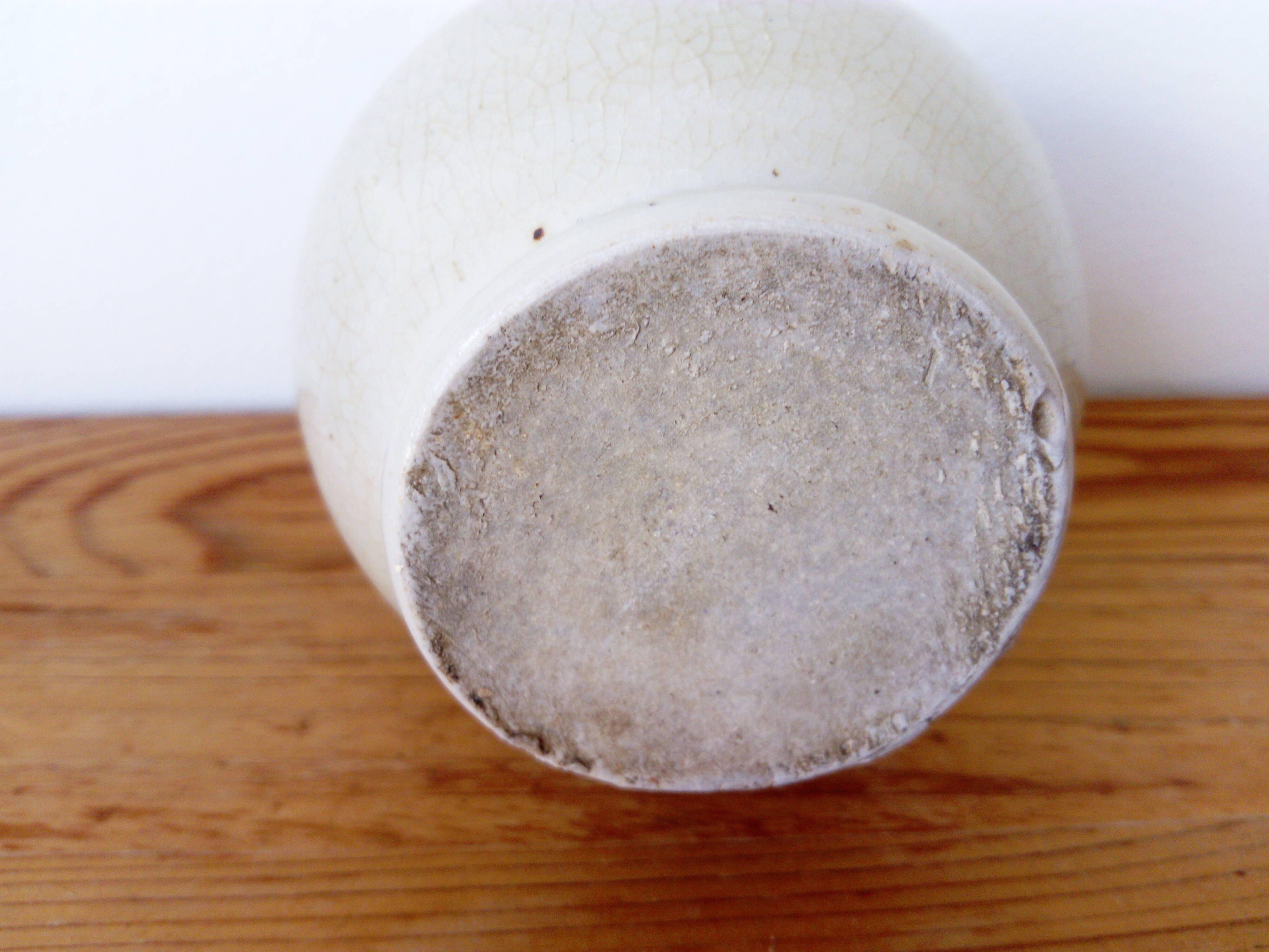 small green and cream glazed ceramic vase