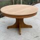 Round extendable Scandinavian dining table in Baumann style oak with central leg