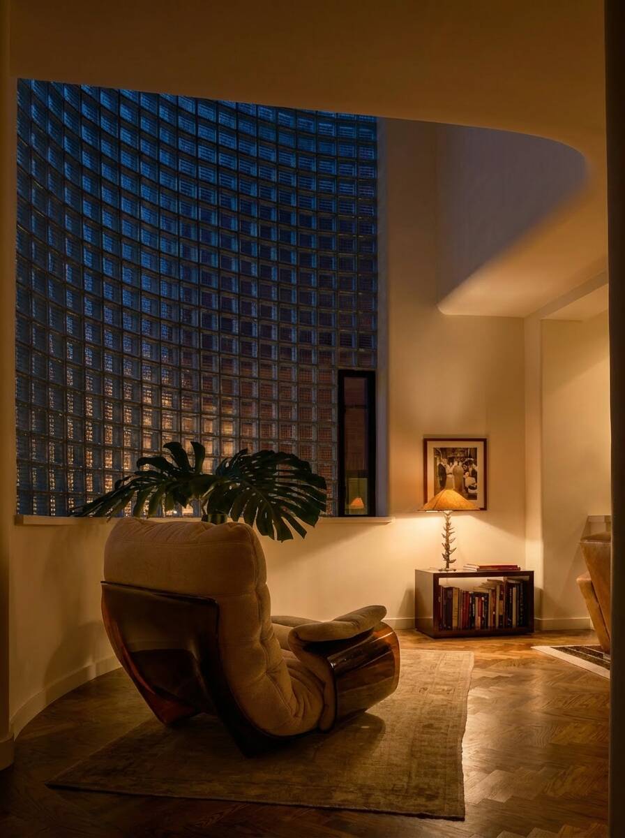 Marsala armchair and its light beige Ligne Roset footrest.