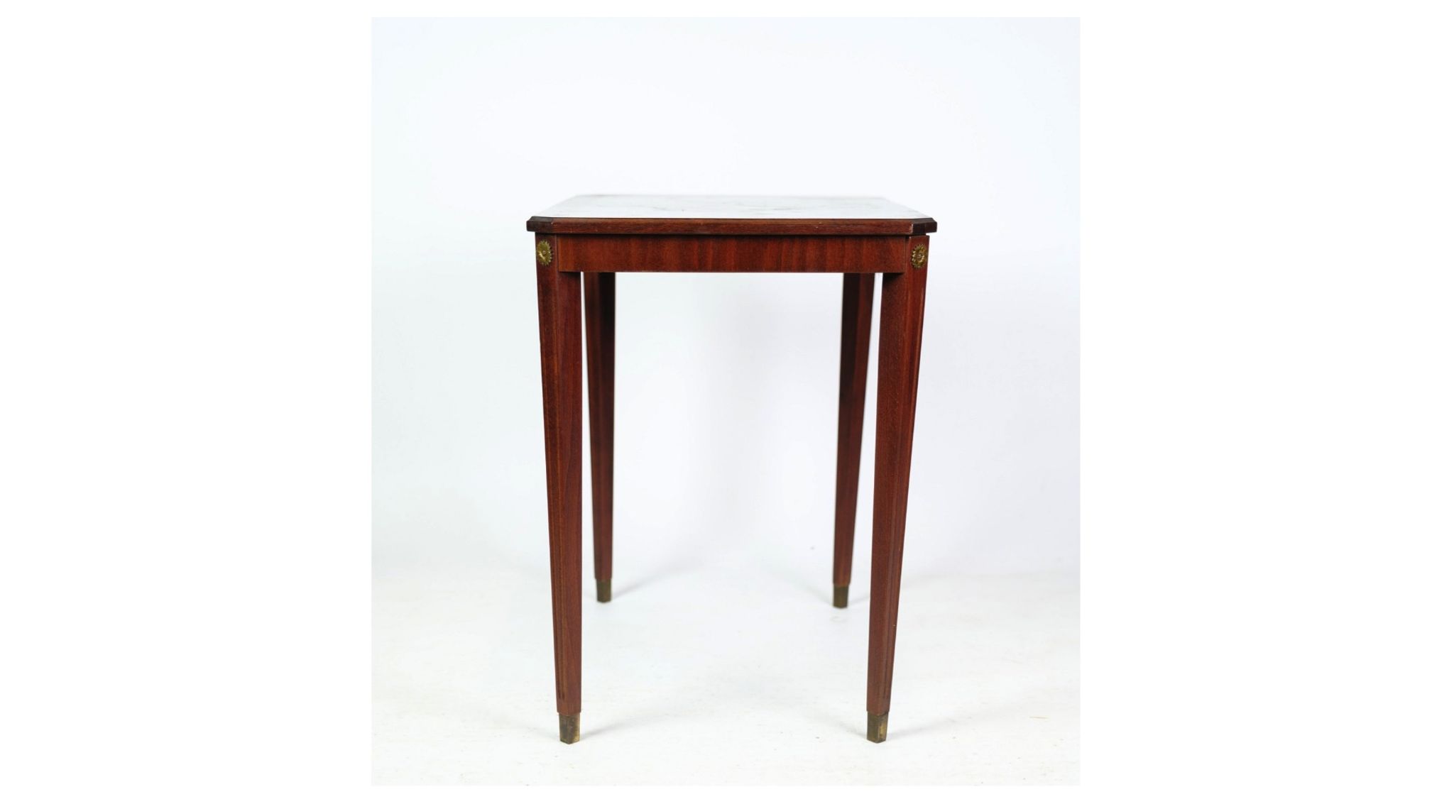 Side table decorated with bronze ornaments in light mahogany