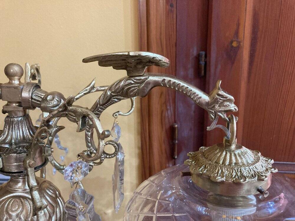 Bronze table lamp with dragon arm and cut glass shade, 1940s