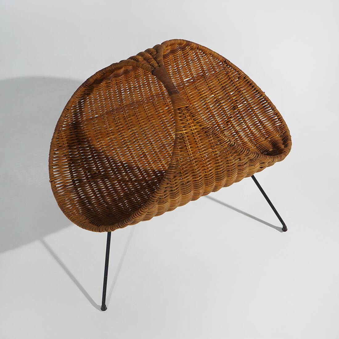 Rattan magazine rack with metal legs, 1950s