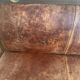 Vintage colonial-style bench in solid wood and patinated leather.
